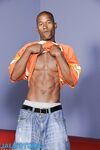 Tall gay ebony Billy Long strips & shows his six pack and monster black dick