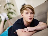 Horny gay Andrea High removes his clothes and strokes his boner in a solo