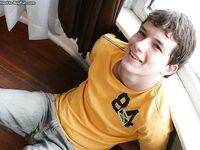 Good-looking brunette twink Devin Moss shows off his suckable big dick