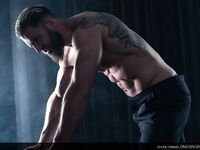 Muscular gay shows off his athletic naked body and his big dick