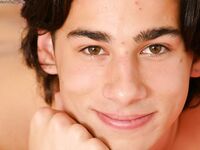 Long-haired gay Marek doffs his clothes and poses naked on his bed