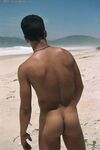 Young good-looking gay Leo 2 strips fully naked & jerks off at the beach