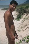 Young good-looking gay Leo 2 strips fully naked & jerks off at the beach