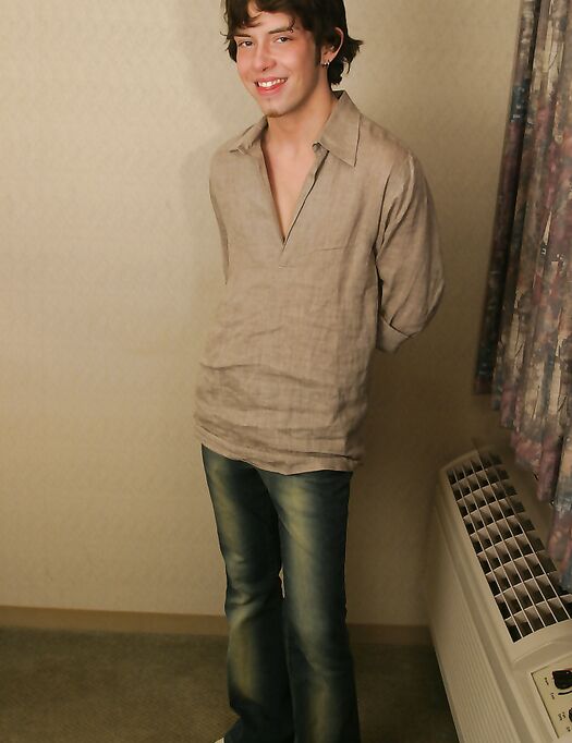 Gay beauty Aaron strips, unveils his lean body and strokes his cut dick