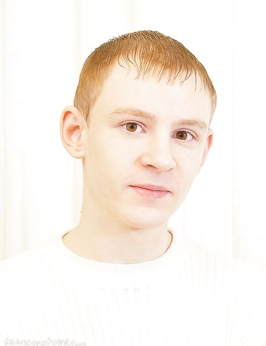 Young gay shows off his fully erect big dick while completely naked