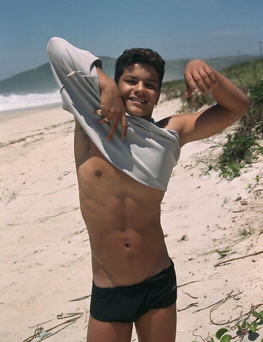 Young good-looking gay Leo 2 strips fully naked & jerks off at the beach